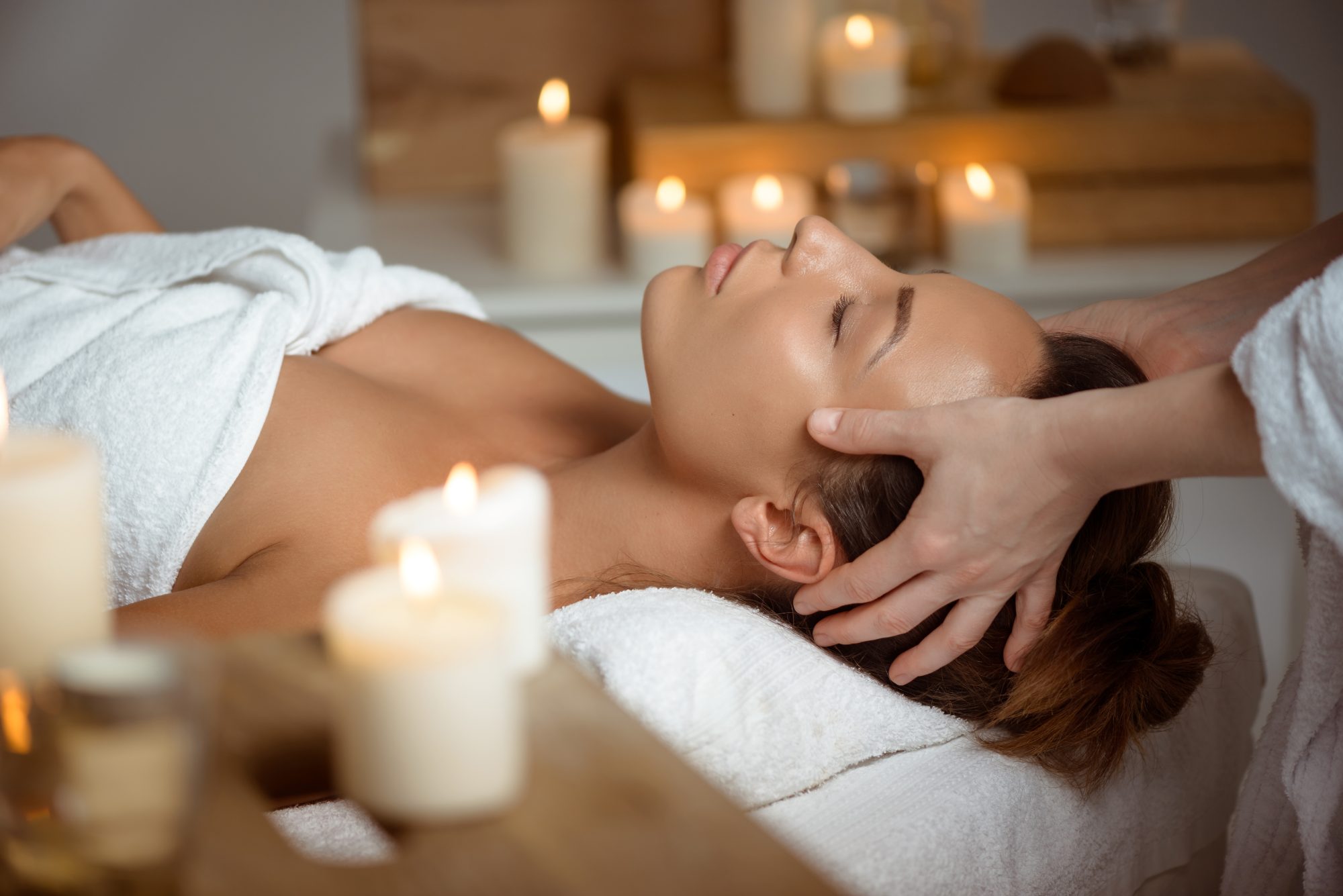 Relaxing head and face massage by candlelight