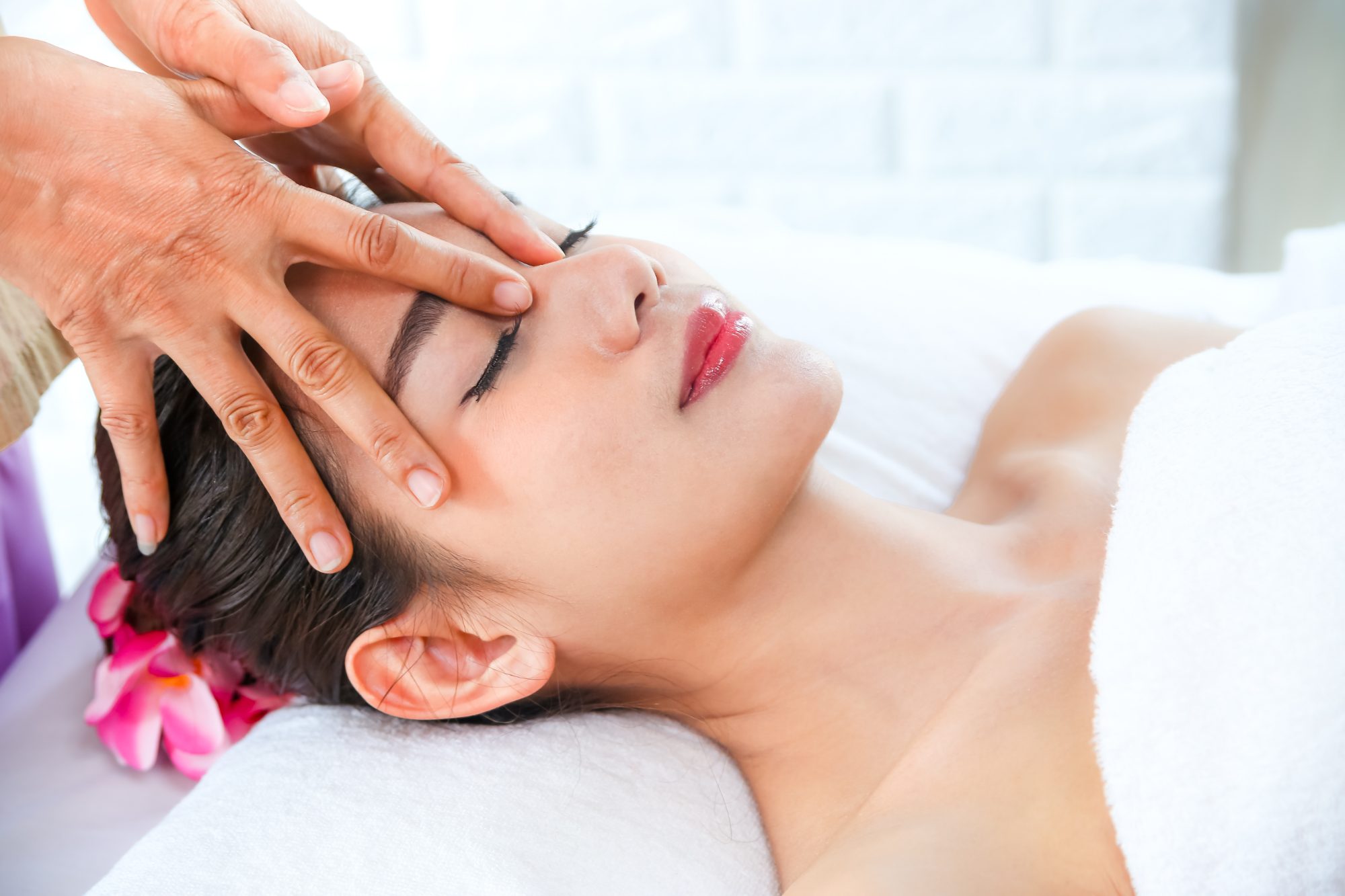Woman enjoying a Chinese head massage